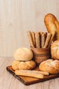 ÃÂ¡risp bread with buns. French baguettes. Fresh crispbread. Bread background. Different breed on wooden background